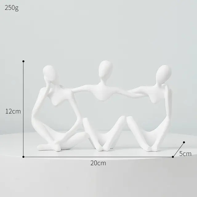 Three white Nordic style decorative art figurines. sitting, holding each other- Epiceasyshop1 