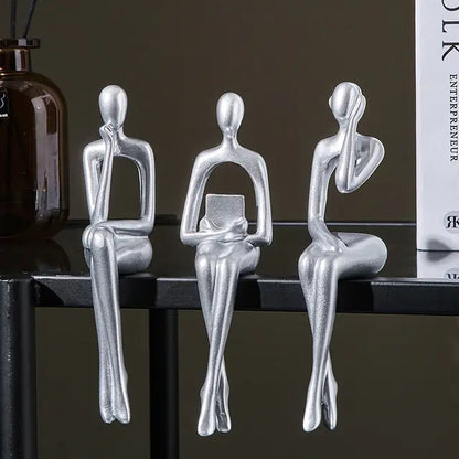 Three Nordic style decorative art figurines. Silver colored, sitting next to each other- Epiceasyshop1